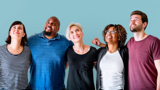 A group of cheerful, diverse friends stood with arms around each other, capturing a heartwarming moment of togetherness.